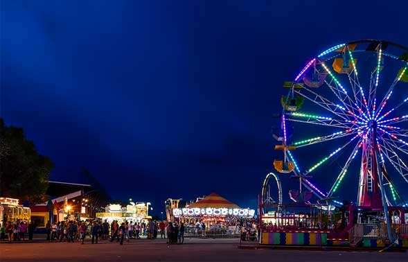 Ferris wheel with people standing