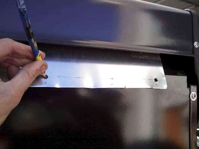 Figure 21: Mark Screw Holes on the Grill to Match the Shield